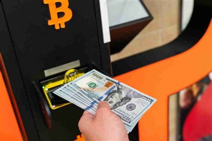 How do I deposit money into a Bitcoin ATM?