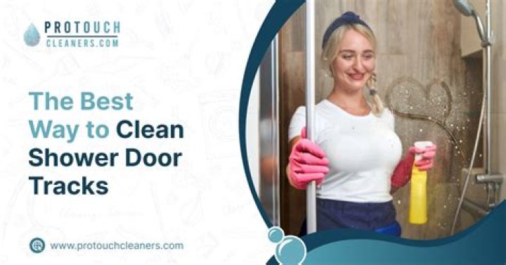 How do I keep my shower door tracks clean?