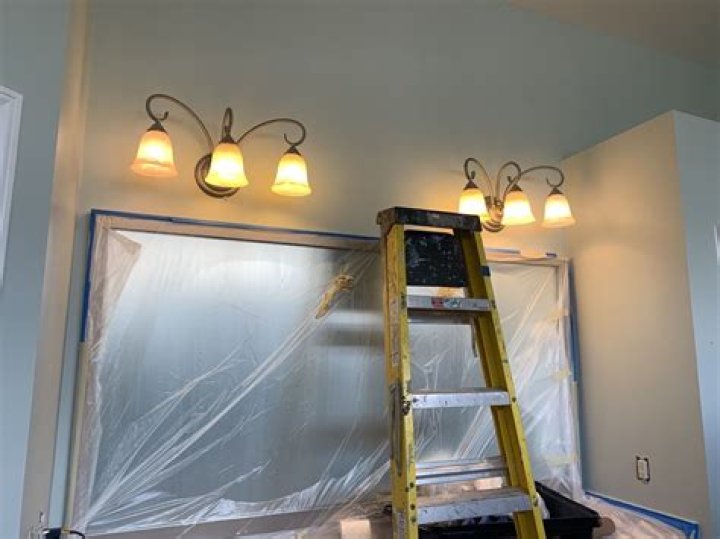 How do painters reach high ceilings?