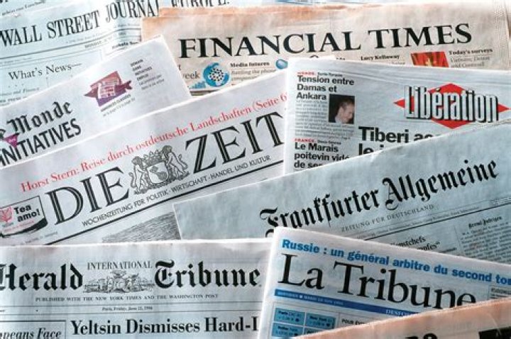 How do traditional newspapers make money?