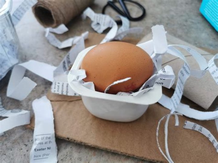 How do you keep an egg from breaking when dropped with paper?