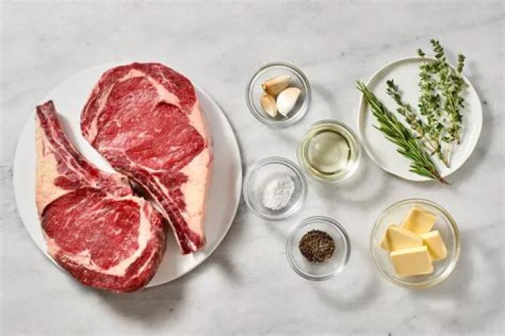 How do you prepare a steak before cooking?
