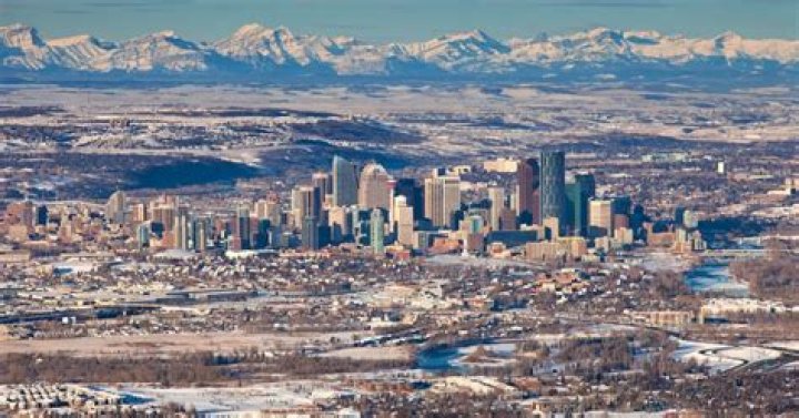 Is Calgary or Edmonton bigger area?
