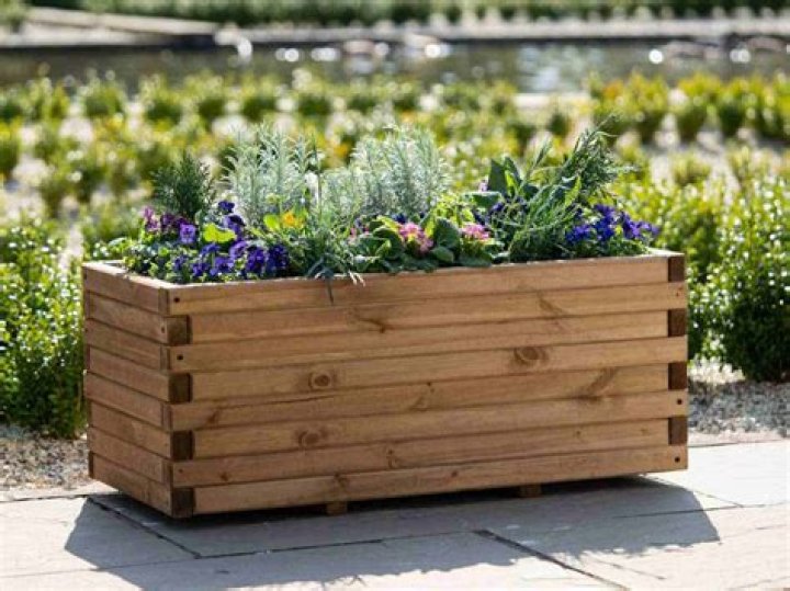 What do you put on the bottom of a planter box?