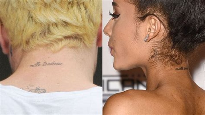 What does Ariana's back tattoo say?
