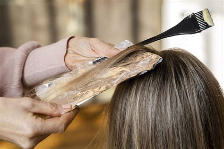 When applying hair color what part of the hair should you start?