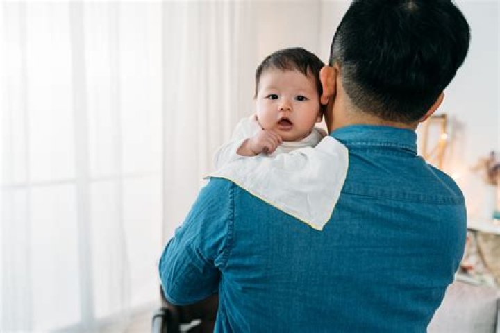 Where do you hit to burp a baby?