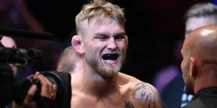 Why do fighters breathe out when they punch?